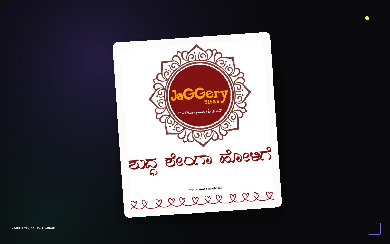 Jaggery Bites stall signage with mandala seal and Kannada lettering on a studio card